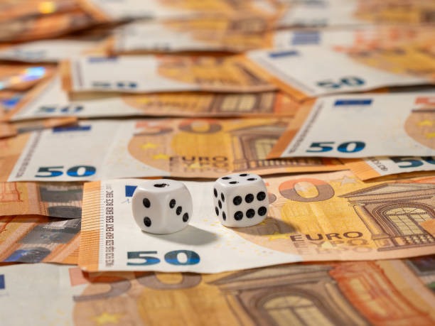 Dealer handling a baccarat game in multiscreen setup